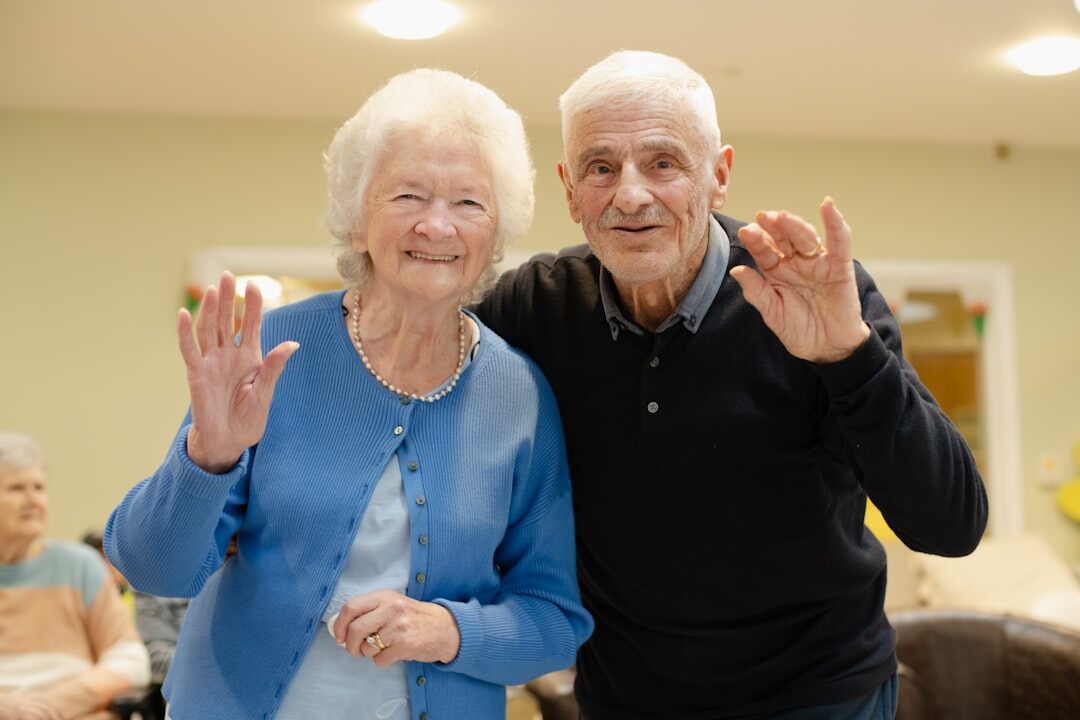 Seniors sitting in a theatre audience applauding