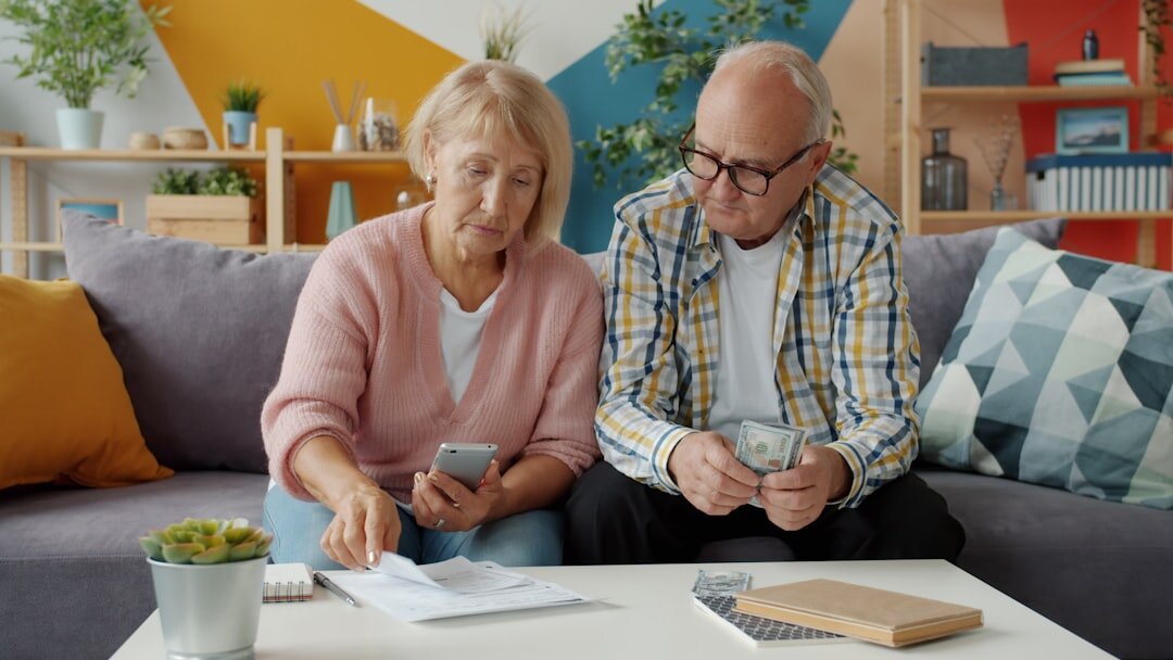 Senior couple reviewing financial documents together at home
