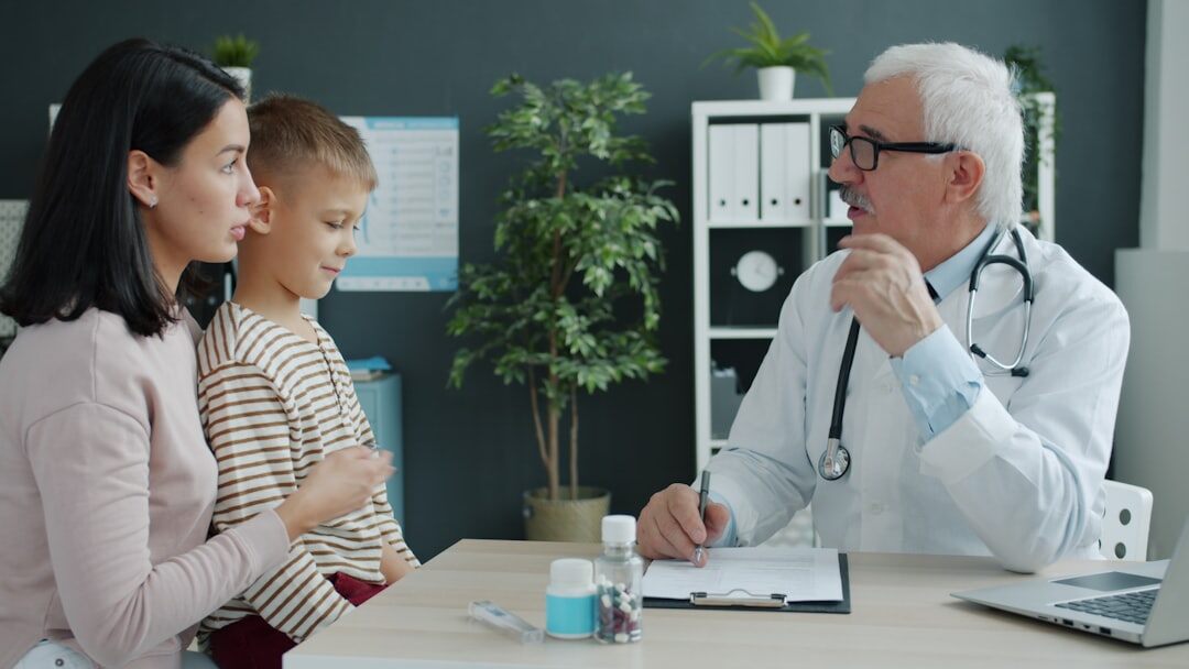 Senior patient talking with a doctor during a checkup